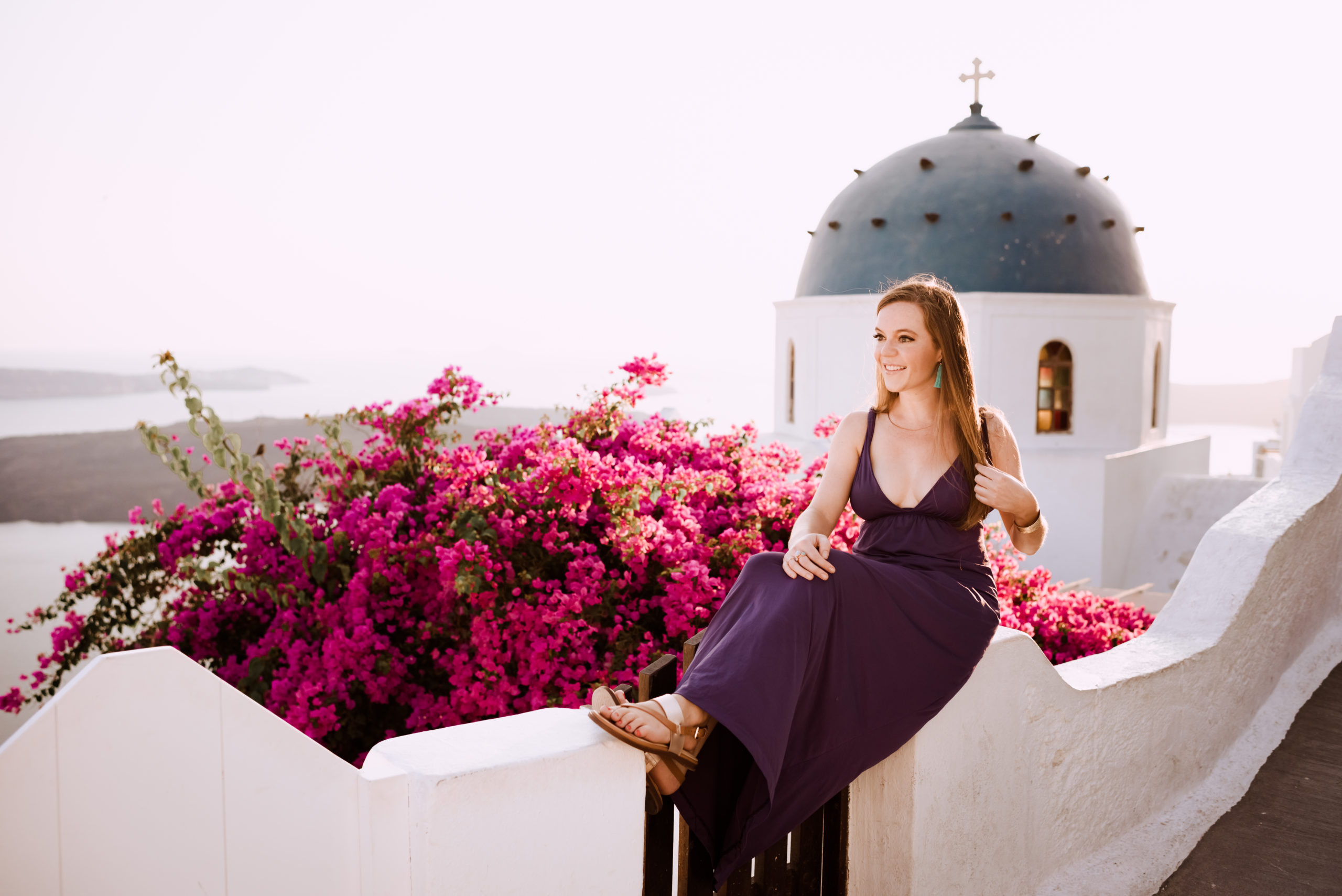 Woman sitting on a wall